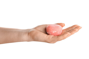Woman holding delicious mochi on white background