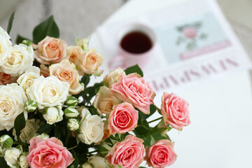 Bouquet of beautiful fresh roses on in room, closeup