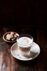 Coffee with milk on dark background. Soft focus. Copy space.