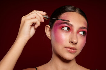 Obraz premium Beauty fashion female bright makeup posing fashion emotions cosmetics cropped view unaltered