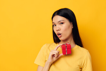 woman holding a gift box in his hands posing isolated background unaltered