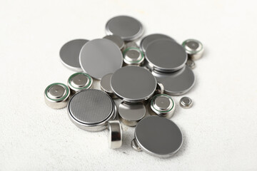 Metal lithium button cell batteries on white background