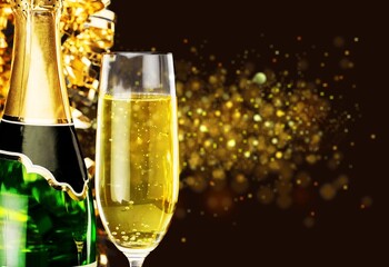 Two glasses of champagne with glitter light on background, new year 2022