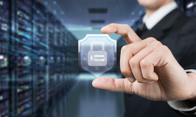 Businessman holding a shield with a padlock on a worldwide networking connection, Data protection and security