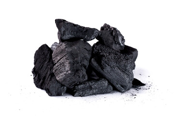 Pile of natural wood charcoal Isolated on white background. activated carbon.