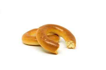 Whole and bitten bagels isolated on a white background