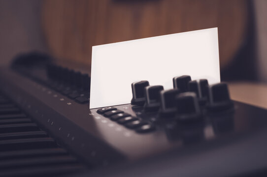 Mockup of a business card that sticks out in a synthesizer or midi keyboard