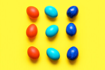 Multicolored Easter eggs on color background