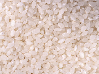 White rice seen from above - organic and vegan food - texture background