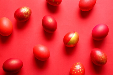 Stylish Easter eggs on red background