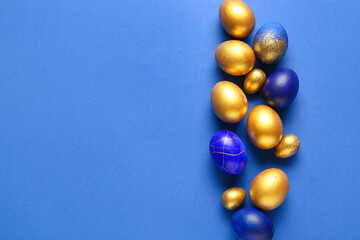 Stylish Easter eggs on blue background