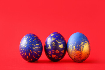 Stylish Easter eggs on red background