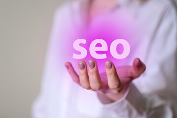 Seo in a woman's manicured hands, seo icon.