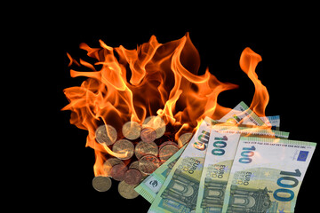 inflation in the world with many burning 100 euro bills and coins with black