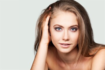 Fototapeta premium Beautiful young woman with clean fresh skin, Face care, Facial treatment, Cosmetology