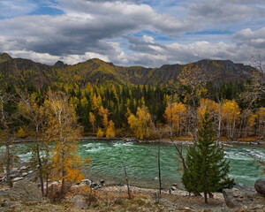 Russia. The South of Western Siberia, Altai Mountains. Only in the middle of autumn, when the mountain glaciers stop melting, the water in the Chuya River becomes transparent and rich turquoise color.