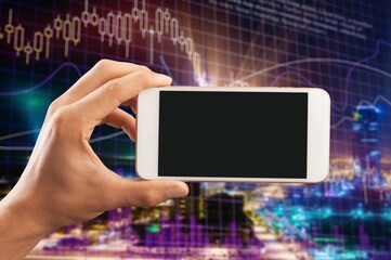 Crypto trader investor broker holding using cell phone app executing financial stock trade market