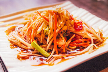 Thai Papaya salad with peanuts and dried shrimp. Asian food
