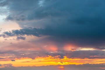 Beautiful clouds in the sky. Colorful sunset or dawn. landscape with sunbeams