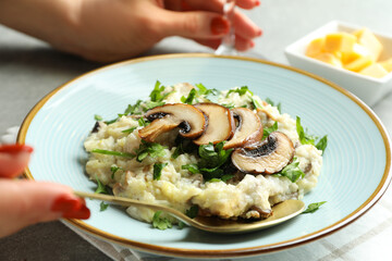 Concept of tasty food with risotto with mushrooms, close up