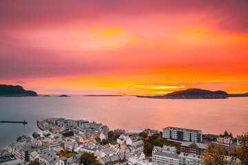 Alesund, Norway. Amazing Natural Bright Dramatic Sky In Warm Colours Above Alesund Valderoya And Islands In Sunset Time. Colorful Sky Background. Beauty In Norwegian Nature.Alesund, Norway. Amazing