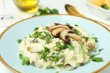 Concept of tasty food with risotto with mushrooms, close up