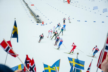 Fototapeta premium Nordic ski competitions. Athletes on the professional Track, Image for Winter Game in Beijing 2022
