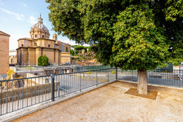 Scenic view on ruins of Roman Forum with Church of Saints Luke and Martina. Rome cityscape on a...