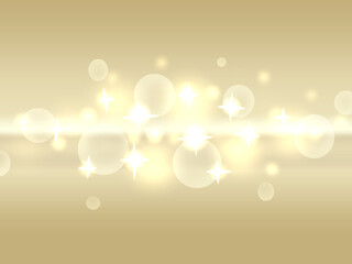 ピンボケの光とゴールドのグラーデション背景