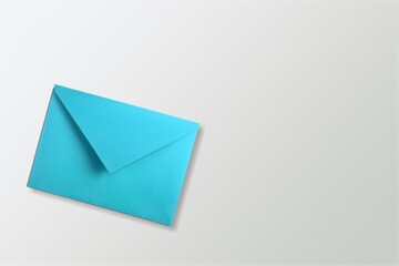 Colored bright envelope on background is flat rectangular shaped paper container
