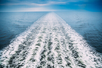 Sea. Water Ocean Waves Trails From Floating Ship Or Ferry Boat. Top View.Sea. Water Ocean Waves...