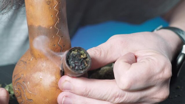 one of a series of smoking medical cannabis. smoking pipe with medical marijuana close-up. 4k