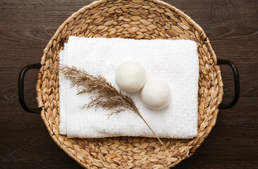 Natural wool dryer balls for more soft clothes while tumble drying in washing machine concept....