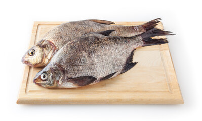 Common river breams on cutting board isolated on white background. Freshwater fish