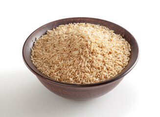 Brown rice in ceramic bowl isolated on white background with clipping path