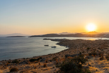 Magnificent landscape from the top point to the bay with yachts and the sun at sunset. - 484128254