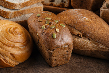 Closeup on assorted variety of fresh baked loaves of bread