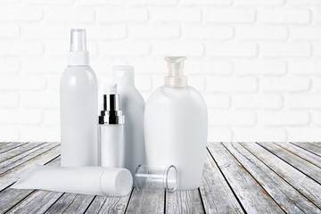 Facial cream and another cosmetic on the table. Mockup for design