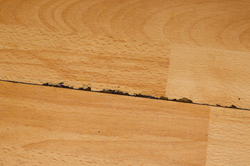 damaged laminate close-up. cracked flooring