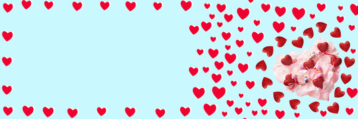 Red hearts, birds and flowers on a blue background. Festive banner for Valentine's day. copy space.