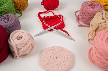 cotton yarn knitting pattern on white table.