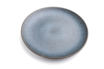 Empty blue ceramic plate isolated on white background. Side view, close up.