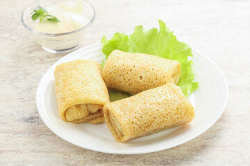 Stuffed pancakes with meat and cream