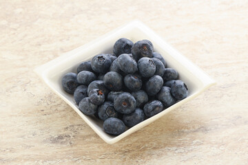 Sweet ripe blueberry heap in the bowl