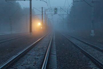 Fototapeta na wymiar The train is traveling in bad cloudy foggy weather