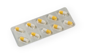 Blister pack with white-yellow pills on a white background