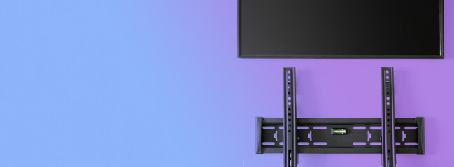 Wall mounted metal bracket with bubble level for wall mounting a TV or monitor. Gradient color...