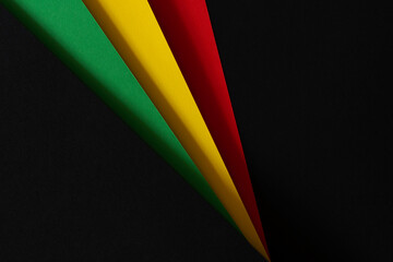 Abstract geometric black, red, yellow, green color paper background. Black History Month color background with copy space for text