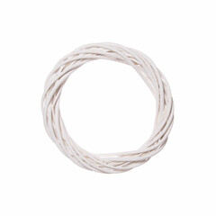 Hoop of knitted white wicker on a white background. Minimal creative concept of a decorative circle of wood.