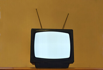 Old portable TV with antenna.